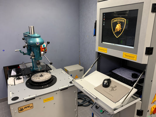 GTE Engineering flywheel balancing machine and control workstation with gray tile flooring