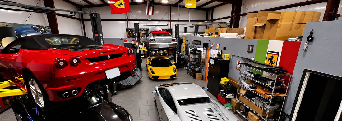 Panoramic view of Ferrari, Lamborghini and Maserati vehicles in the GTE Engineering workshop with gray tile flooring