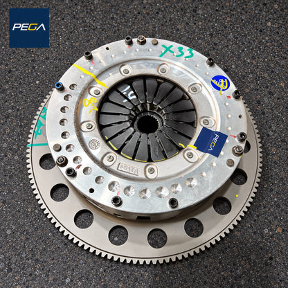 Aston Martin V12 clutch rebuild service example showing pressure plate, flywheel and original inspection marks